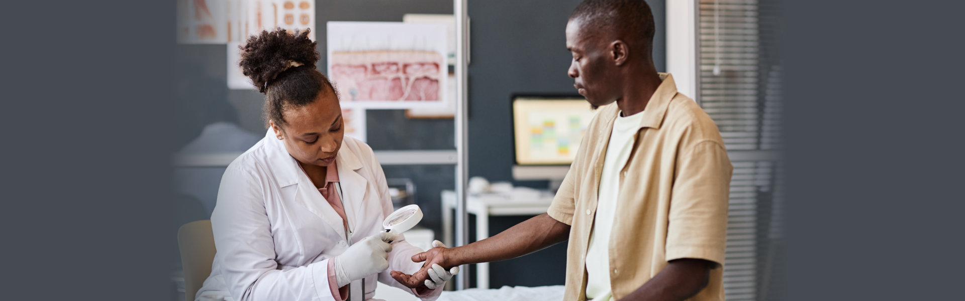 Side view medical scene with female dermatologist examining patient using magnifying glass in clinic